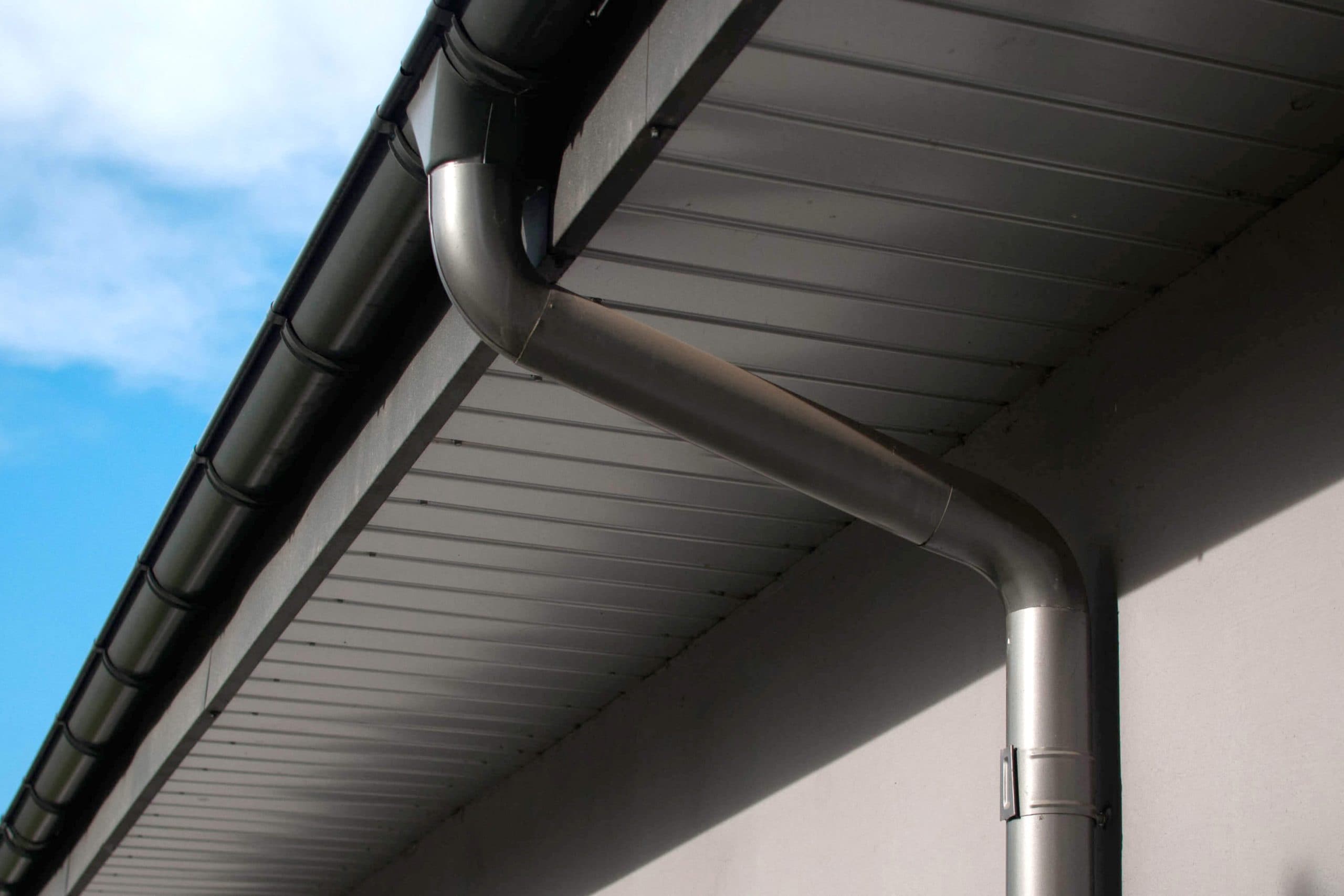 Corrosion-resistant galvanized gutters installed on a commercial building in Lincoln